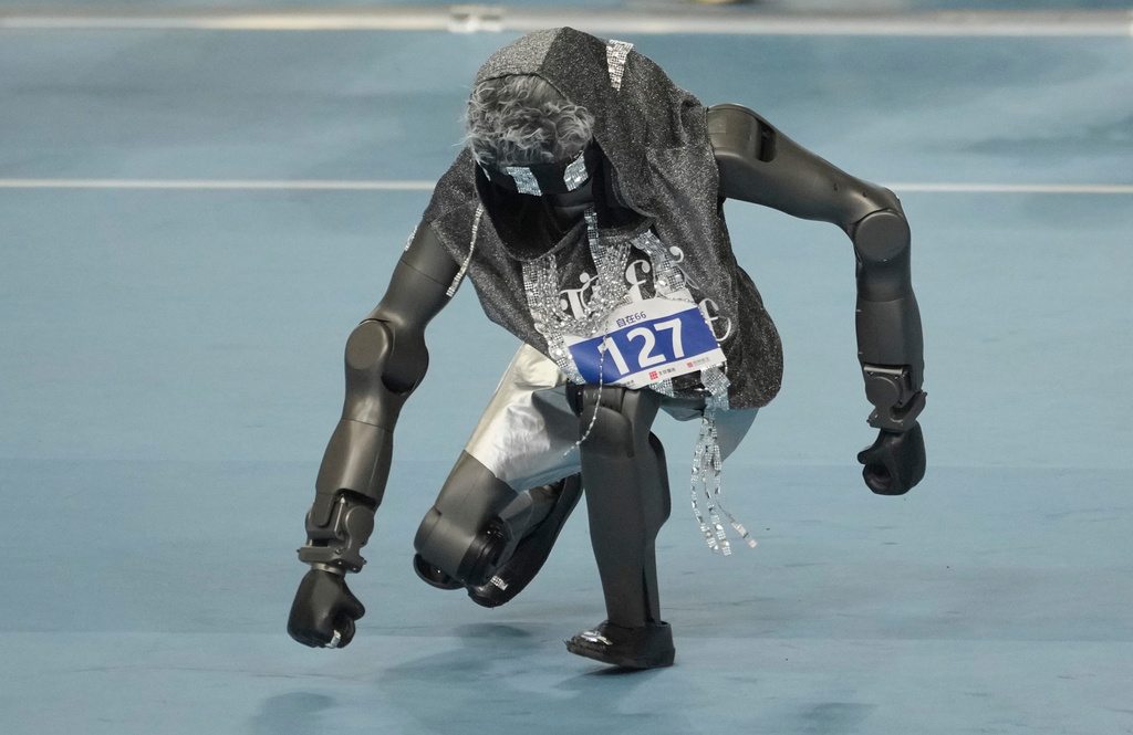 A humanoid robot competes in the breakdance during the World Humanoid Robot Games in Beijing, Tuesday, Aug. 25, 2026. (AP Photo/Achmad Ibrahim)