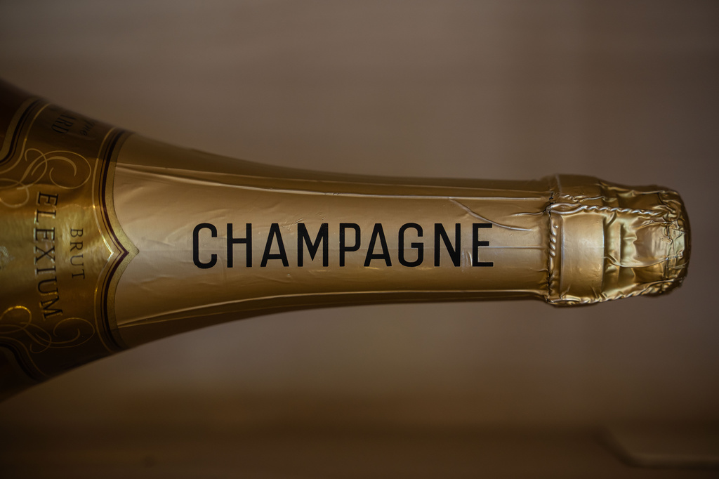 A bottle of champagne in display at the Gobillard vineyard in Hautvillers, Champagne region, France, Tuesday, Aug. 18, 2026. (AP Photo/Aurelien Morissard)