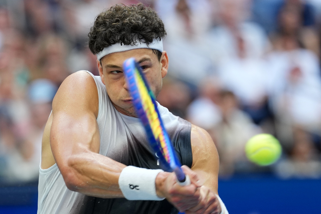 Ben Shelton, of the United States, returns the ball to Alexander Zverev, of Germany, during the men's singles final of the U.S. Open tennis championships Sunday, Sept. 13, 2026, in New York. (AP Photo/Kirsty Wigglesworth)