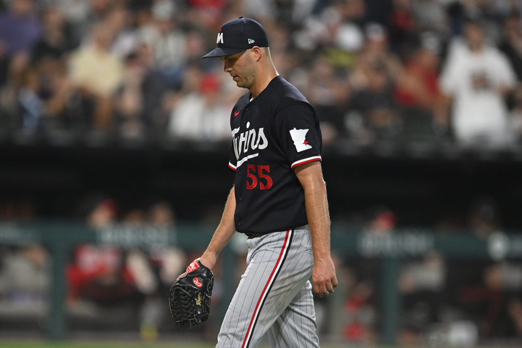 Minnesota Twins relief pitcher Taylor Rogers reacts after being pulled during the seventh inning of a baseball game against the Chicago White Sox Friday, Sept. 4, 2026, in Chicago. (AP Photo/Paul Beaty)