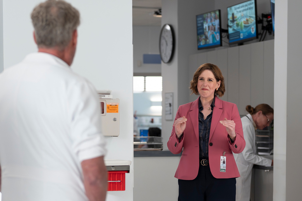 This image released by Disney shows John C. McGinley, left, and Vanessa Bayer in a scene from "Scrubs." (Darko Sikman/Disney via AP)
