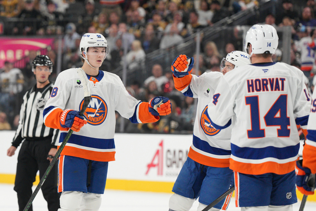 New York Islanders defenseman Matthew Schaefer (48) celebrates after his first-period goal against the Vegas Golden Knights in an NHL hockey game Thursday, Nov. 13, 2025, in Las Vegas. (AP Photo/Candice Ward)