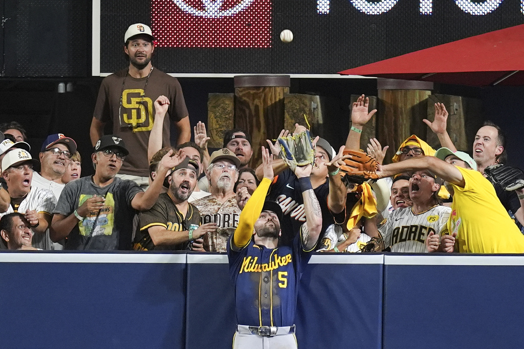 Milwaukee Brewers center fielder Garrett Mitchell catches a ball hit by San Diego Padres' Manny Machado during the eighth inning in Game 4 of baseball's National League Division Series Wednesday, Oct. 7, 2026, in San Diego. (AP Photo/Gregory Bull)