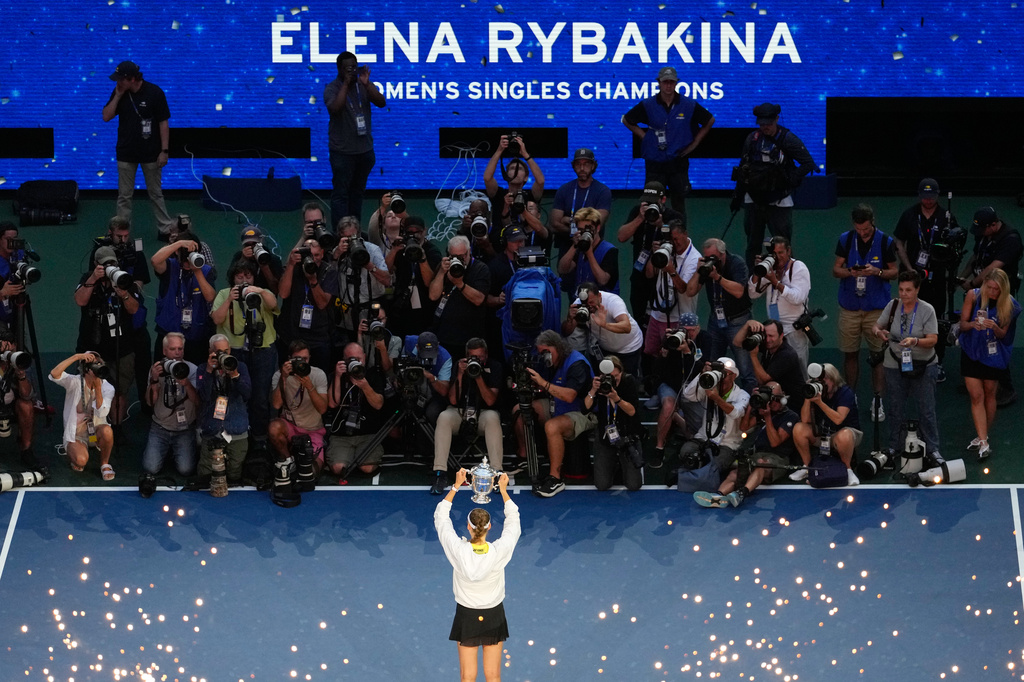 Elena Rybakina, of Kazakhstan, holds the trophy after she won the women's singles final of the U.S. Open tennis championships against Aryna Sabalenka, of Belarus, Saturday, Sept. 12, 2026, in New York. (AP Photo/Yuki Iwamura)
