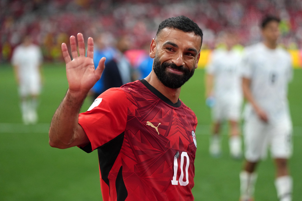 Egypt's Mohamed Salah (10) smiles and waves to fans as he leaves the field following the team's victory in the World Cup Group G soccer match between New Zealand and Egypt in Vancouver, British Columbia, Sunday, June 21, 2026. (Darryl Dyck/The Canadian Press via AP)