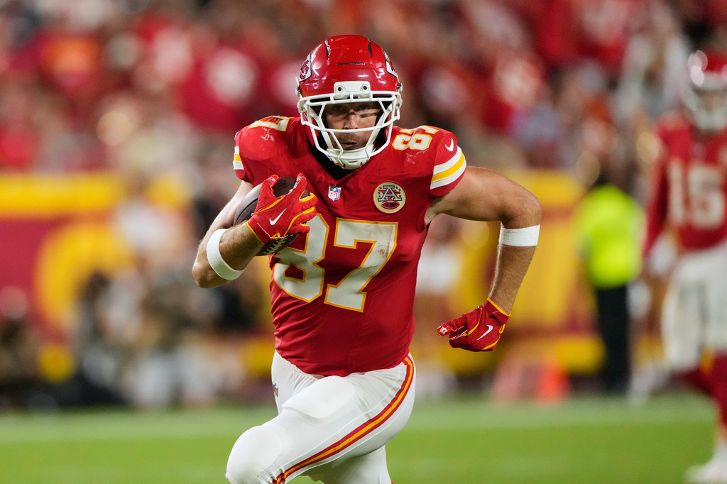 Kansas City Chiefs tight end Travis Kelce runs the ball after making a catch against the Denver Broncos during the second half of an NFL football game Monday, Sept. 14, 2026, in Kansas City, Mo. (AP Photo/Charlie Riedel)