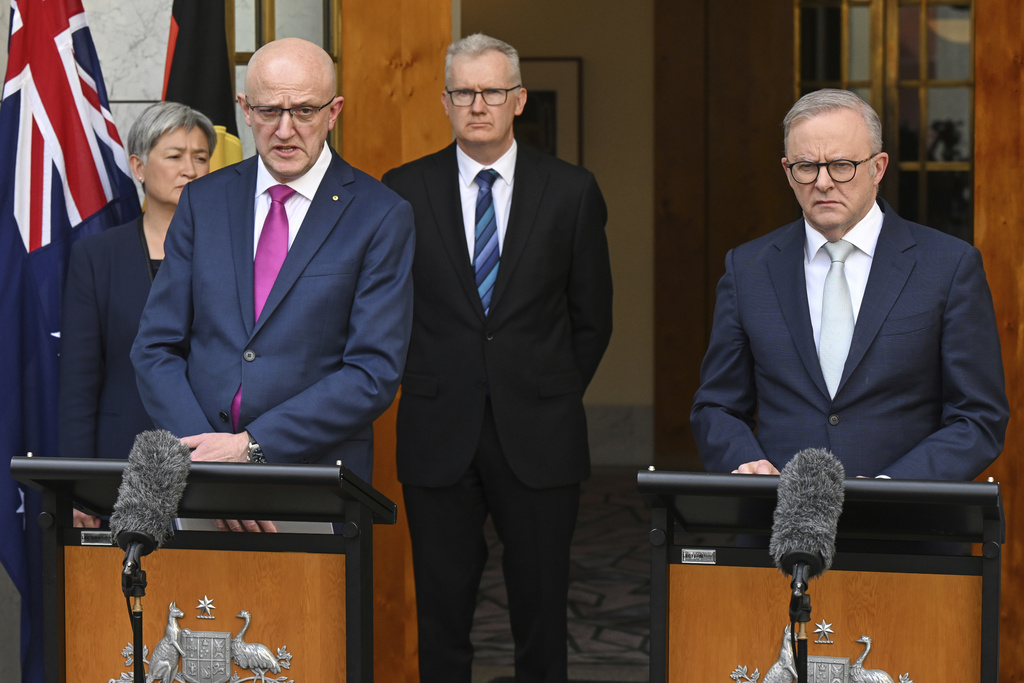 Australian Prime Minister Anthony Albanese, right, and Director-General of ASIO Mike Burgess speak to the media during a press conference at Parliament House in Canberra, Australia, Tuesday, Aug. 26, 2025. (Lukas Coch/AAP Image via AP)