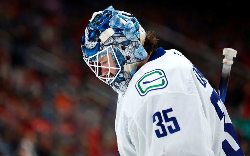 Vancouver Canucks goaltender Thatcher Demko looks on during the second period of an NHL hockey game against the New Jersey Devils, Sunday, Dec 14, 2025, in Newark, N.J. (AP Photo/Noah K. Murray)