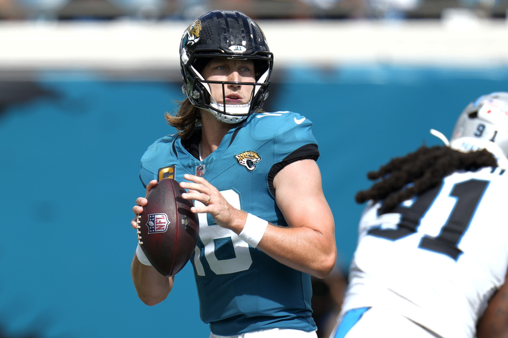 Jacksonville Jaguars quarterback Trevor Lawrence (16) looks to pass the ball against the Carolina Panthers during the second half of an NFL football game, Sunday, Sept. 7, 2025, in Jacksonville, Fla. (AP Photo/John Raoux)