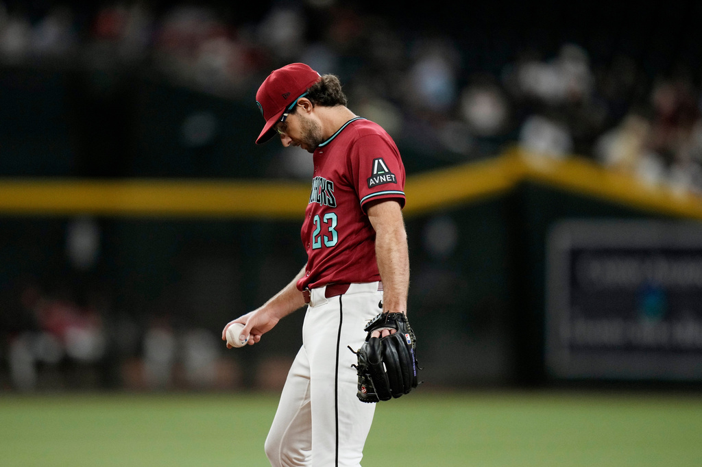 Arizona Diamondbacks starting pitcher Zac Gallen pauses on the pitcher's mound after giving up a two-run home against San Francisco Giants' Victor Bericoto during the fifth inning of a baseball game, Wednesday, July 1, 2026, in Phoenix. (AP Photo/Ross D. Franklin)