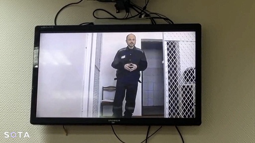 In this photo taken from video released by Russian independent news outlet SOTA telegram channel, Russian opposition activist Vladimir Kara-Murza is seen on a TV screen during a video broadcast provided by the Russian Federal Penitentiary Service during a hearing, at Zamoskvoretsky court, in Ufa, Russia, Thursday, Feb. 22, 2024. Jailed opposition politician Vladimir Kara-Murza on Thursday urged Russians to keep fighting for democracy despite the death of Alexei Navalny in an Arctic prison. (Russian independent news outlet SOTA telegram channel via AP)