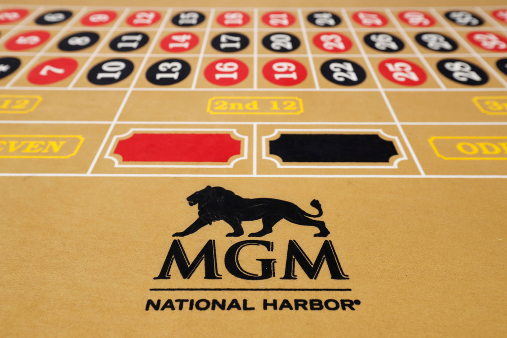 FILE - The MGM National Harbor logo is seen on a roulette table in the casino during a preview tour of the MGM National Harbor, Dec. 2, 2016 in Oxon Hill, Md. (AP Photo/Alex Brandon, File)