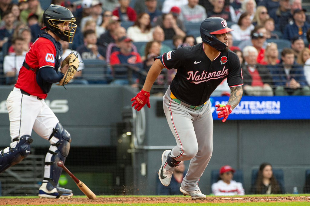 Washington Nationals' Luis Garcia Jr., right, watches his two-run single off Cleveland Guardians relief pitcher Logan Allen as catcher Patrick Bailey look on during the sixth inning of a baseball game, Monday, May 25, 2026, in Cleveland. (AP Photo/Phil Long)