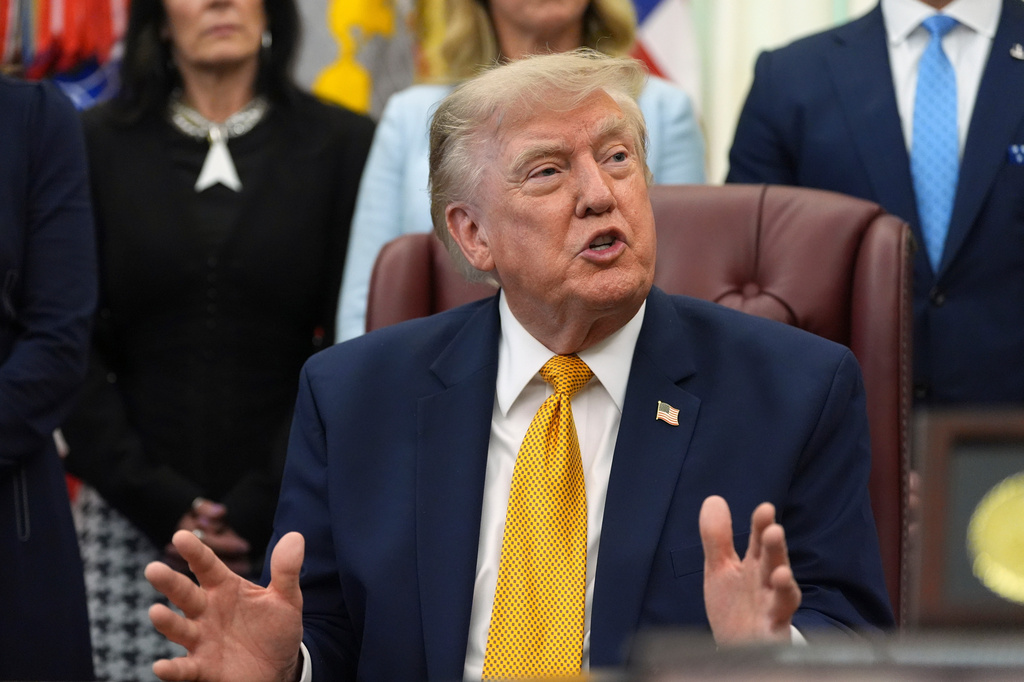 President Donald Trump speaks during a meeting about military families, in the Oval Office of the White House, Monday, Aug. 3, 2026, in Washington. (AP Photo/Alex Brandon)