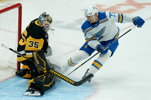 St. Louis Blues' Nick Bjugstad (77) scores against Pittsburgh Penguins goaltender Tristan Jarry (35) during the first period of an NHL hockey game Monday, Oct. 27, 2025, in Pittsburgh. (AP Photo/Matt Freed) St. Louis Blues' Nick Bjugstad (77) scores against Pittsburgh Penguins goaltender Tristan Jarry (35) during the first period of an NHL hockey game Monday, Oct. 27, 2025, in Pittsburgh. (AP Photo/Matt Freed)