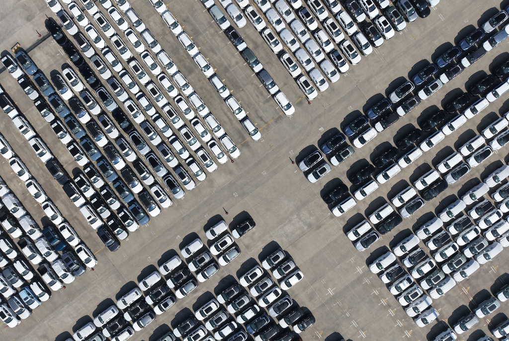 FILE -An aerial view of new cars awaiting export to oversea markets is seen at a port in Shanghai, March 10, 2026. (Chinatopix via AP, File)
