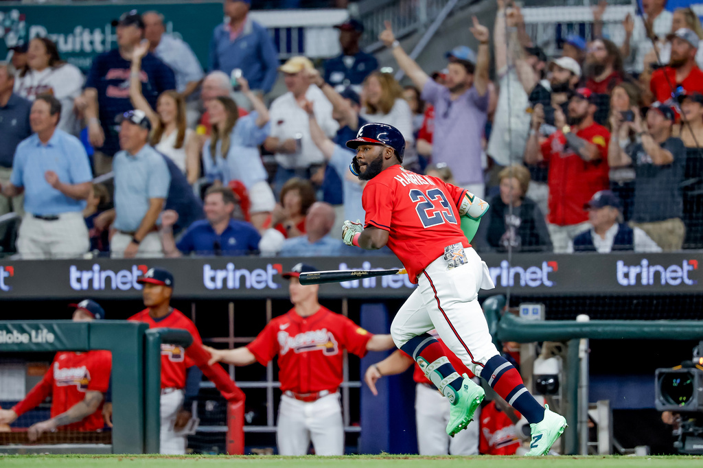 Atlanta Braves pinch hitter Michael Harris II (23) runs down the first base line after hitting a two-RBI double against the Philadelphia Phillies during the sixth inning of a baseball game, Friday, April 24, 2026, in Atlanta. (AP Photo/Erik S. Lesser)