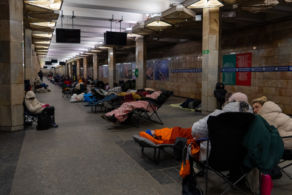 People take shelter in a metro station, being used as a bomb shelter, during a Russian drones attack in Kyiv, Ukraine, Tuesday, Feb. 3, 2026. (AP Photo/Alex Babenko)