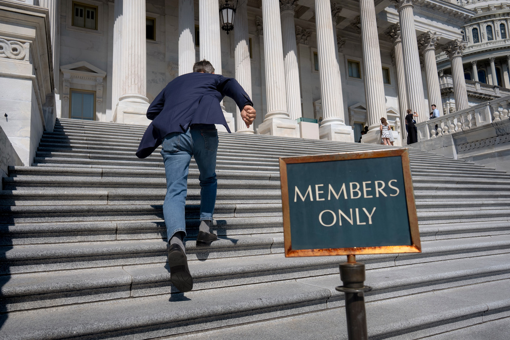 Rep. Darrell Issa, R-Calif., rushes up the steps at the Capitol for final votes before the House of Representatives leaves for a five-week recess, in Washington, Thursday, July 23, 2026. (AP Photo/J. Scott Applewhite)