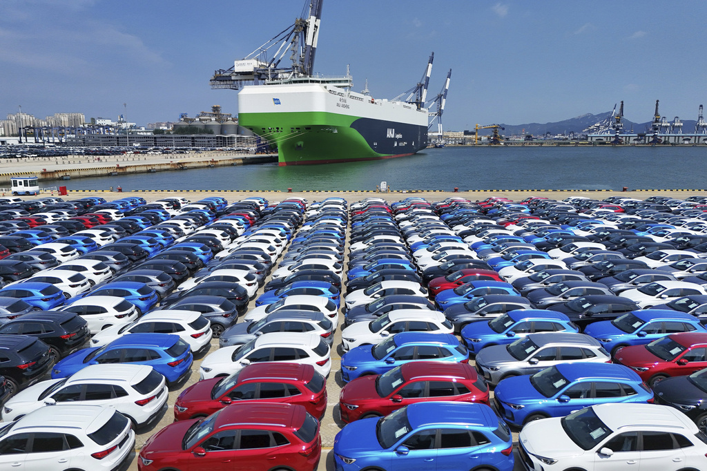 An aerial view of new cars awaiting shipment to foreign markets from a port in Yantai in east China's Shandong province Thursday, Aug. 21, 2025. (Chinatopix via AP)