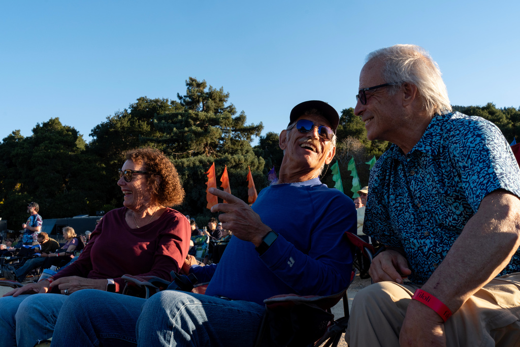 Christy Morrill, center, who lost decades of memories to autoimmune encephalitis, attends a concert with his wife, Karen, left, and friend Steve Weiss, at Filoli, a historic estate, Monday, Aug. 18, 2025, in Woodside, Calif. (AP Photo/David Goldman)
