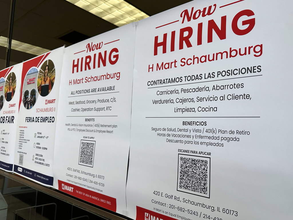 FILE - Hiring sign is displayed at a grocery store in Niles, Ill., Tuesday, Dec. 30, 2025. (AP Photo/Nam Y. Huh)
