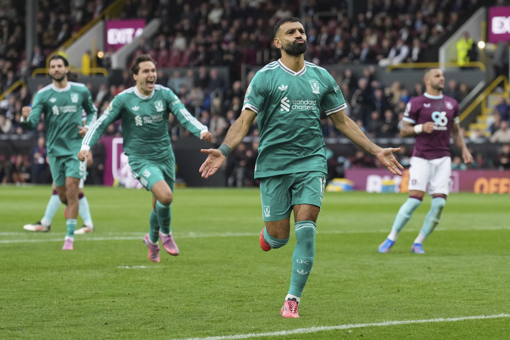 Liverpool's Mohamed Salah celebrate after scoring from a penalty kick during the Premier League soccer match between Burnley and Liverpool in Burnley, England, Sunday, Sept. 14, 2025. (AP Photo/Jon Super)