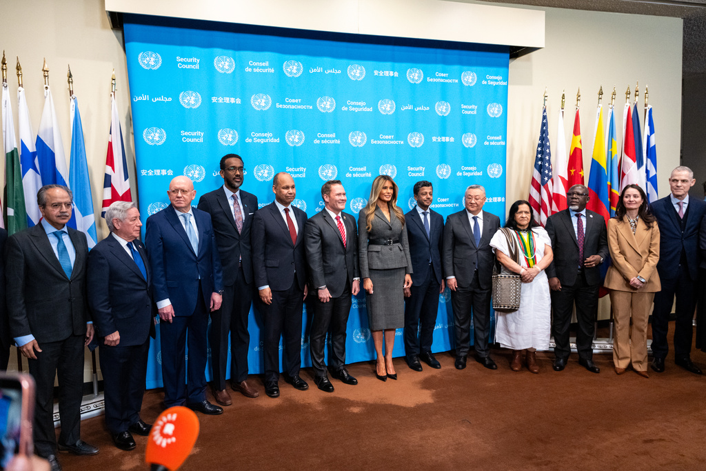 First lady Melania Trump takes a photo with a group of UN Diplomats before she presides over the United Nations Security Council on Iran and the recent attacks by U.S. and Israel at United Nations headquarters, Monday, March 2, 2026. (AP Photo/Angelina Katsanis)