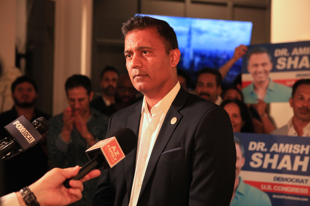 Amish Shah, who is seeking the Democratic nomination for Arizona's 1st Congressional District, speaks to supporters at a friend's home on Tuesday, July 21, 2026, in Phoenix. (AP Photo/Wufei Yu)