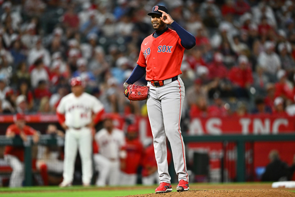 Boston Red Sox pitcher Aroldis Chapman gestures after getting his 1364th career strikeout to hold the MLB record for most strikeouts by a relief pitcher during the ninth inning of a baseball game against the Los Angeles Angels, Friday, July 3, 2026, in Anaheim, Calif. (AP Photo/William Liang)