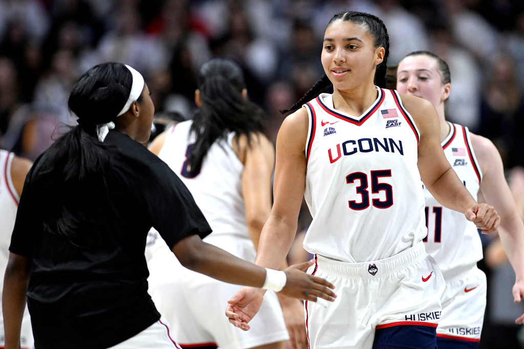 UConn guard Azzi Fudd (35) slaps hands with UConn guard Kelis Fisher in the first half of an NCAA college basketball game against Creighton, Wednesday, Feb. 11, 2026, in Storrs, Conn. (AP Photo/Jessica Hill)