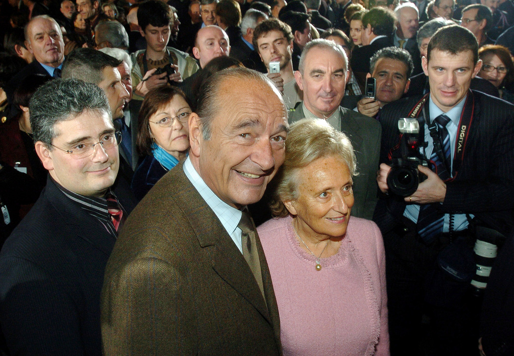 FILE - French President Jacques Chirac, center left, and his wife First Lady Bernadette Chirac are surrounded by the crowd after addressing New Year wishes to the inhabitants of the region of Correze, in Tulle, southwestern France, Saturday, Jan. 14, 2006. (AP Photo/Bob Edme, File)