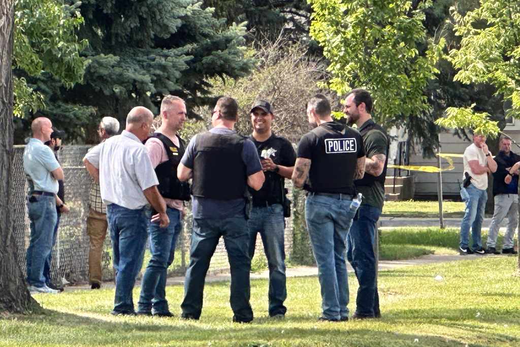 Law enforcement responds to the scene where an Immigration and Customs Enforcement officer shot and killed a suspect after the suspect drove his car at the arresting officers on Friday, Sept. 12, 2025, in Franklin Park, Ill. (AP Photo/Laura Bargfeld)