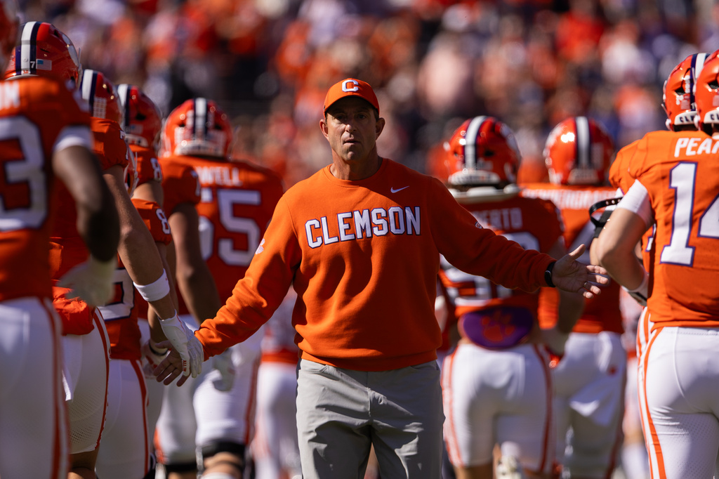 FILE - Clemson head coach Dabo Swinney greets his team before an NCAA college football game against Duke, Nov. 1, 2025, in Clemson, S.C. (AP Photo/Scott Kinser, File)