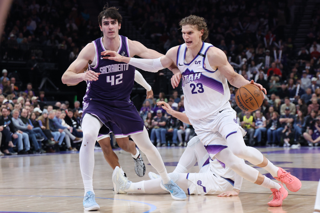 Utah Jazz forward Lauri Markkanen (23) drives to the basket against Sacramento Kings center Maxime Raynaud (42) during the second half of an NBA basketball game, Wednesday, Feb. 11, 2026, in Salt Lake City. (AP Photo/Rob Gray)