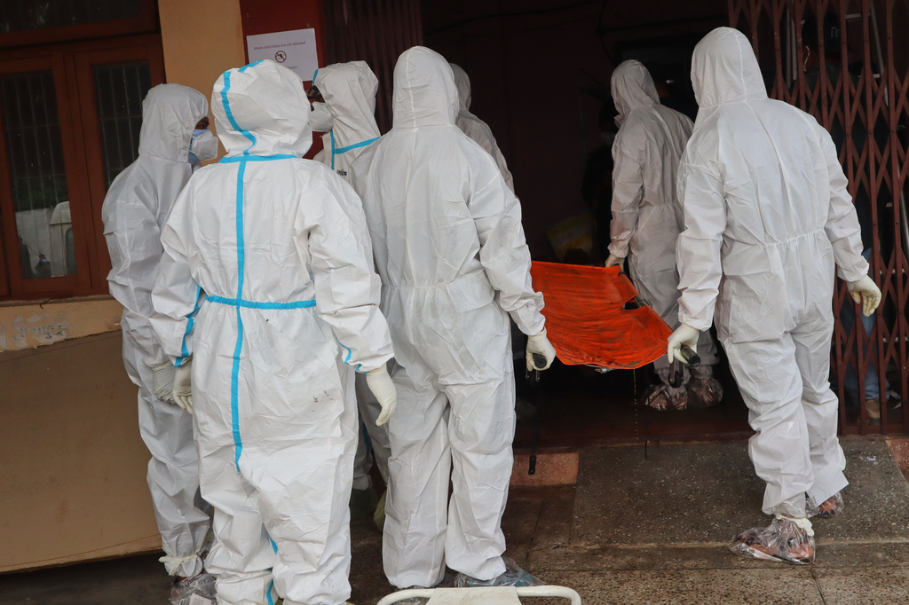 Rescuers keep bodies of flash flood victims in mortuary before a mass burial in Chitwan, Nepal, Saturday, Aug. 29, 2026. (AP Photo/Nisha Shrestha)