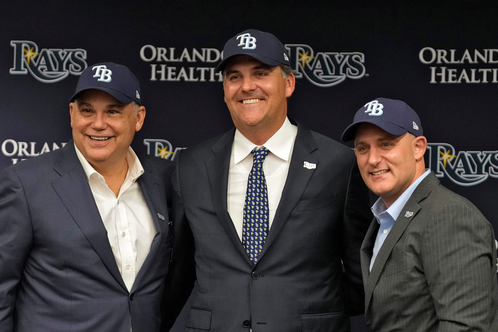 Tampa Bay Rays New owners, from left, co-chairman Bill Cosgrove, managing partner and co-chair Patrick Zalupski, and chief executive officer Ken Babby, pose for a photo during an introductory baseball news conference, Tuesday, Oct. 7, 2025, in Tampa, Fla. (AP Photo/Chris O'Meara)