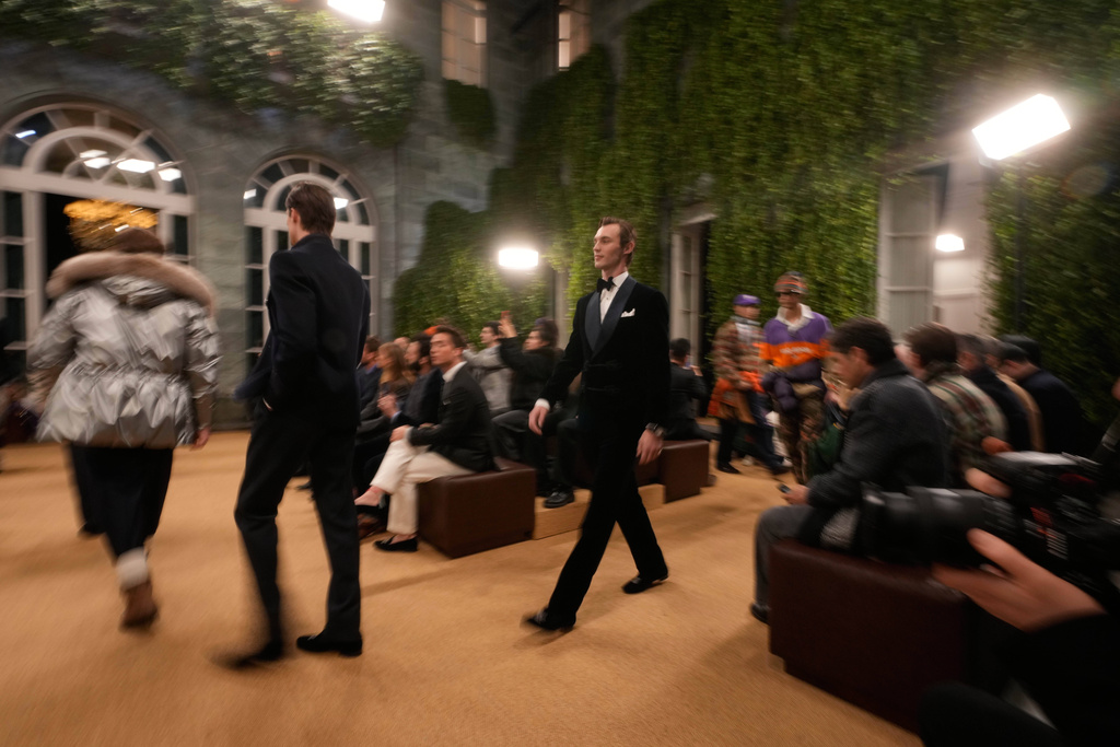 Models wear creations as part of the Ralph Lauren Fall/Winter 2026-2027 Men's collection presented in Milan, Italy, Friday, Jan. 16, 2026. (AP Photo/Luca Bruno)