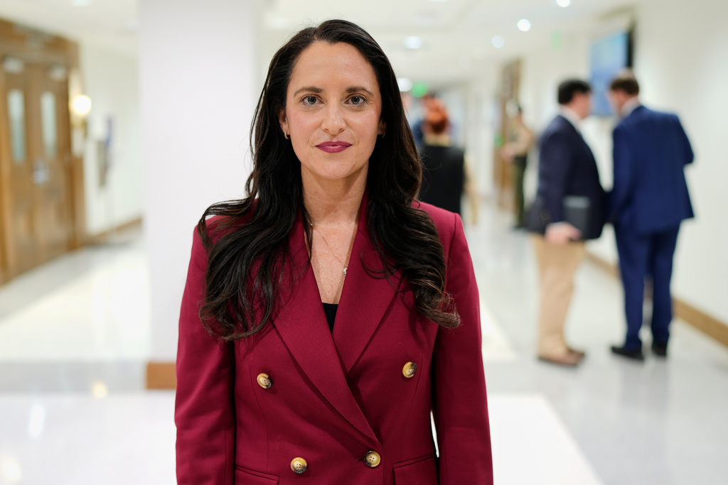 Molecular toxicologist Alexandra Muñoz poses outside a hearing room at the Tennessee State Capitol, Wednesday, Jan. 21, 2026, in Nashville, Tenn. (AP Photo/George Walker IV)