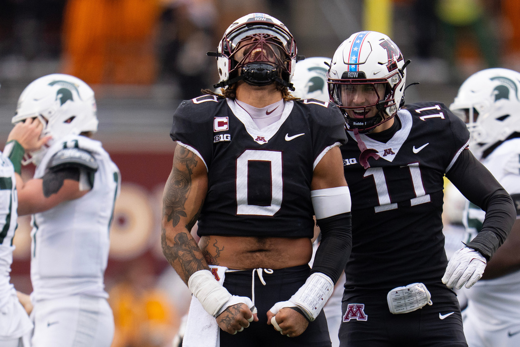 Minnesota defensive lineman Anthony Smith (0) celebrates after sacking Michigan State quarterback Alessio Milivojevic (11) during the first half of an NCAA college football game Saturday, Nov. 1, 2025, in Minneapolis, Minn. (Alex Kormann/Star Tribune via AP)