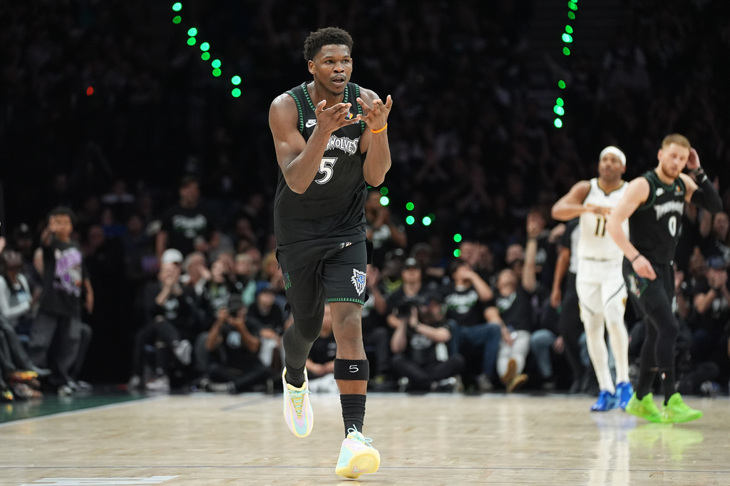 Minnesota Timberwolves guard Anthony Edwards (5) celebrates after making a 3-point shot during the first half in Game 3 of a first-round NBA basketball playoff series against the Denver Nuggets, Thursday, April 23, 2026, in Minneapolis. (AP Photo/Abbie Parr)