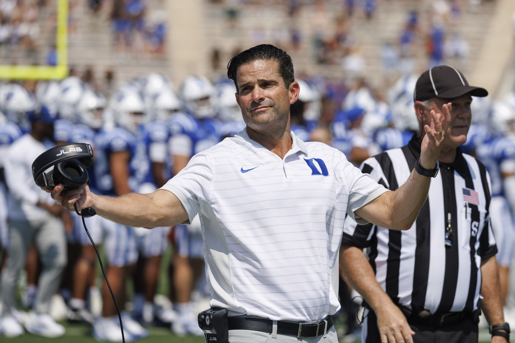 Duke head coach Manny Diaz reacts to a replay during an official review of a potential targeting penalty during the first half of an NCAA college football game against Illinois in Durham, N.C., Saturday, Sept. 6, 2025. (AP Photo/Ben McKeown)