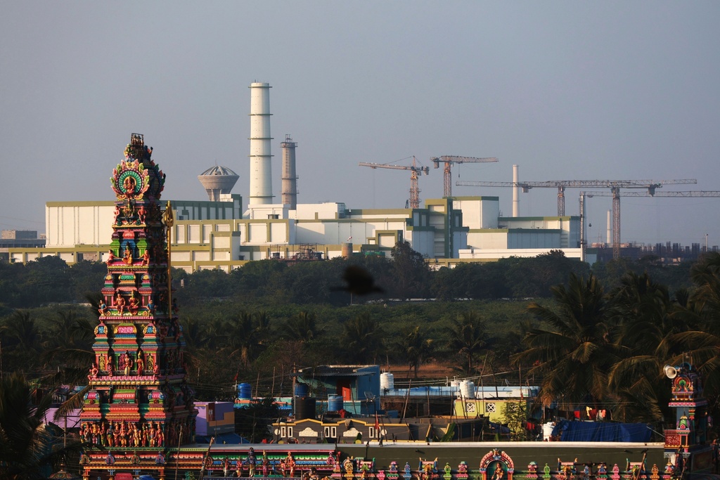 FILE - A temple stands in the foreground of the Madras Atomic Power Station located at Kalpakkam, in the Indian state of Tamil Nadu, Feb. 10, 2025. (AP Photo/R. Parthibhan, File)
