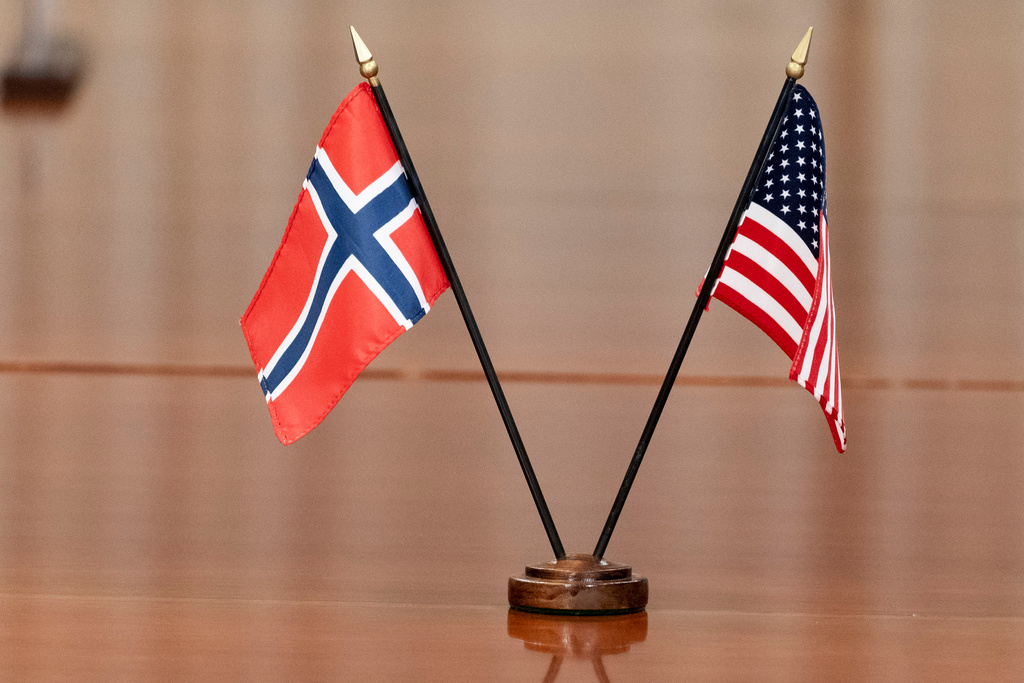 FILE - The Norway, left, and US flags are seen on the table at the Pentagon, on Sept. 20, 2022, in Washington. (AP Photo/Alex Brandon, File)