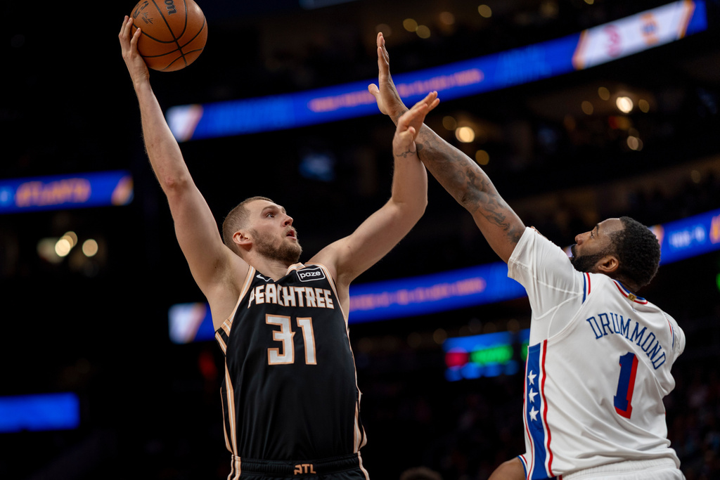 Atlanta Hawks center Jock Landale (31) attempts a basket against Philadelphia 76ers center Andre Drummond (1) during the first half of an NBA basketball game, Saturday, March 7, 2026, in Atlanta. (AP Photo/Erik Rank)