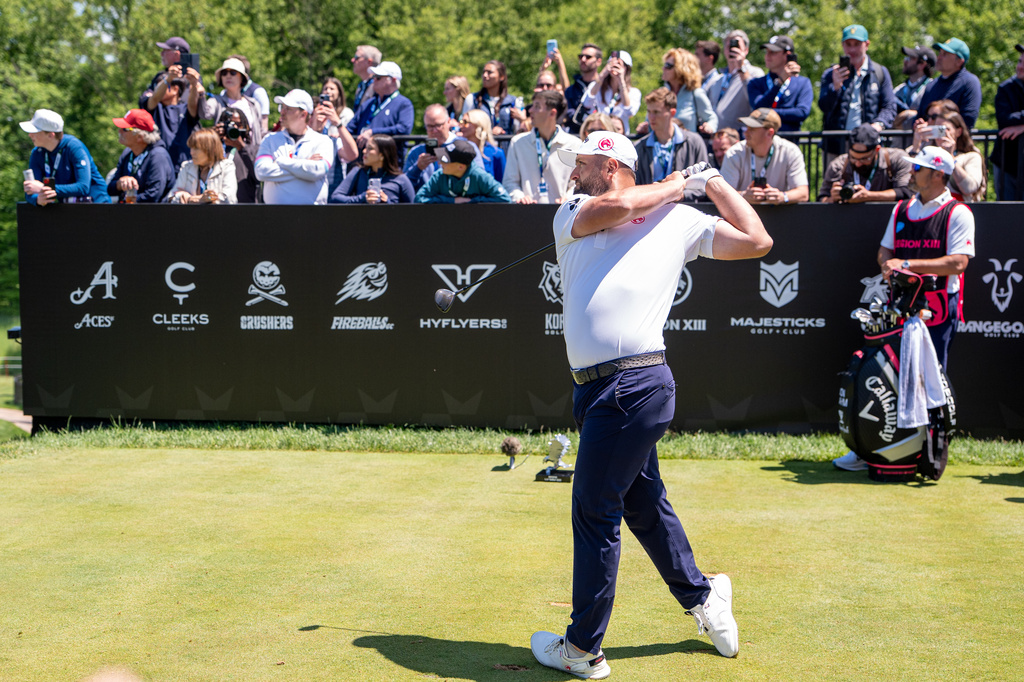 Captain Jon Rahm of Legion XIII hits his shot from the first tee during the first round of the LIV Golf tournament at Trump National Golf Club, Thursday, May 7, 2026 in Sterling, Va. (Pedro Salado/LIV Golf via AP)