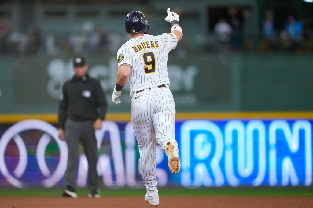 Milwaukee Brewers' Jake Bauers reacts after hitting a home run during the seventh inning of a baseball game against the Cincinnati Reds, Sunday, Sept. 13, 2026, in Milwaukee. (AP Photo/Kayla Wolf)