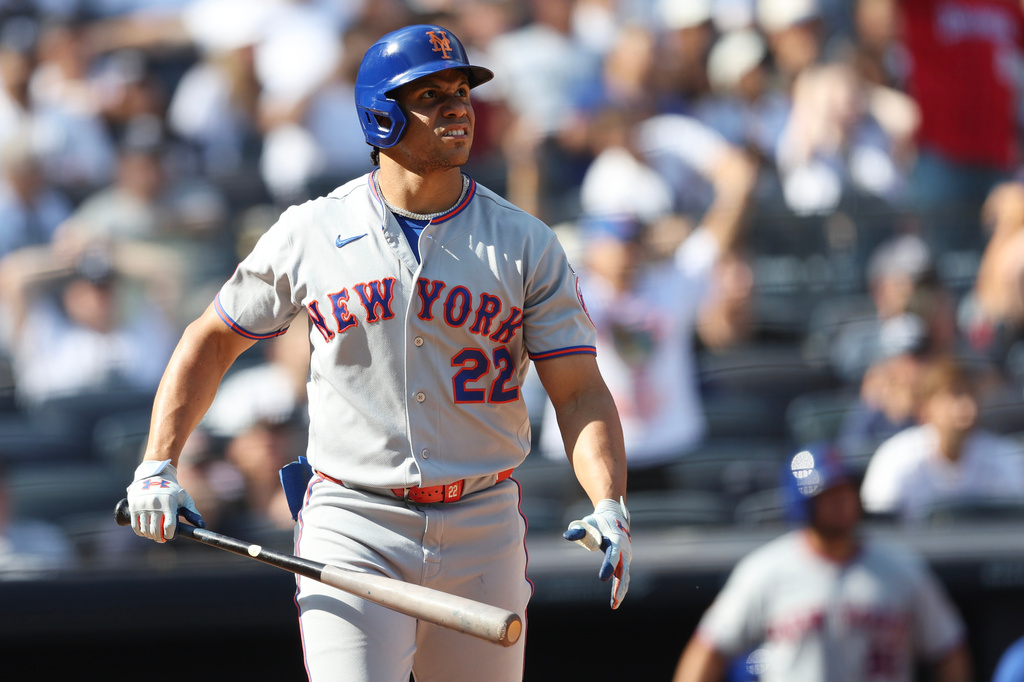 New York Mets' Juan Soto (22) watches his home run during the seventh inning of a baseball game against the New York Yankees, Saturday, Sept. 12, 2026, in New York. (AP Photo/Heather Khalifa)