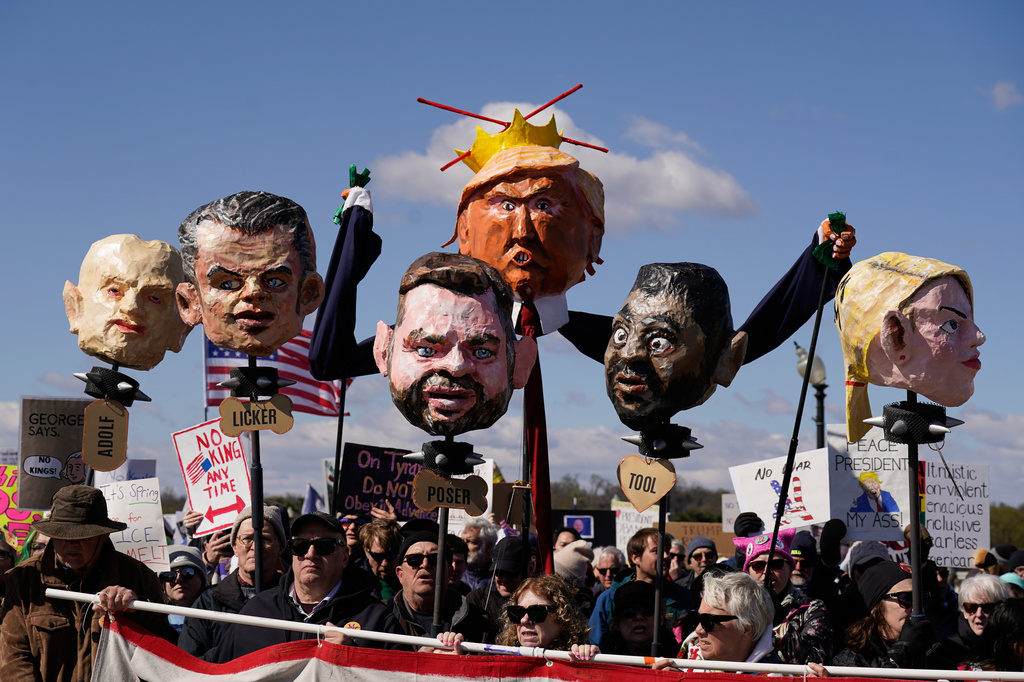 EDS NOTE: OBSCENITY - Demonstrators march near the Memorial Bridge during the No Kings protest in Washington, Saturday, March 28, 2026. (AP Photo/Jose Luis Magana)