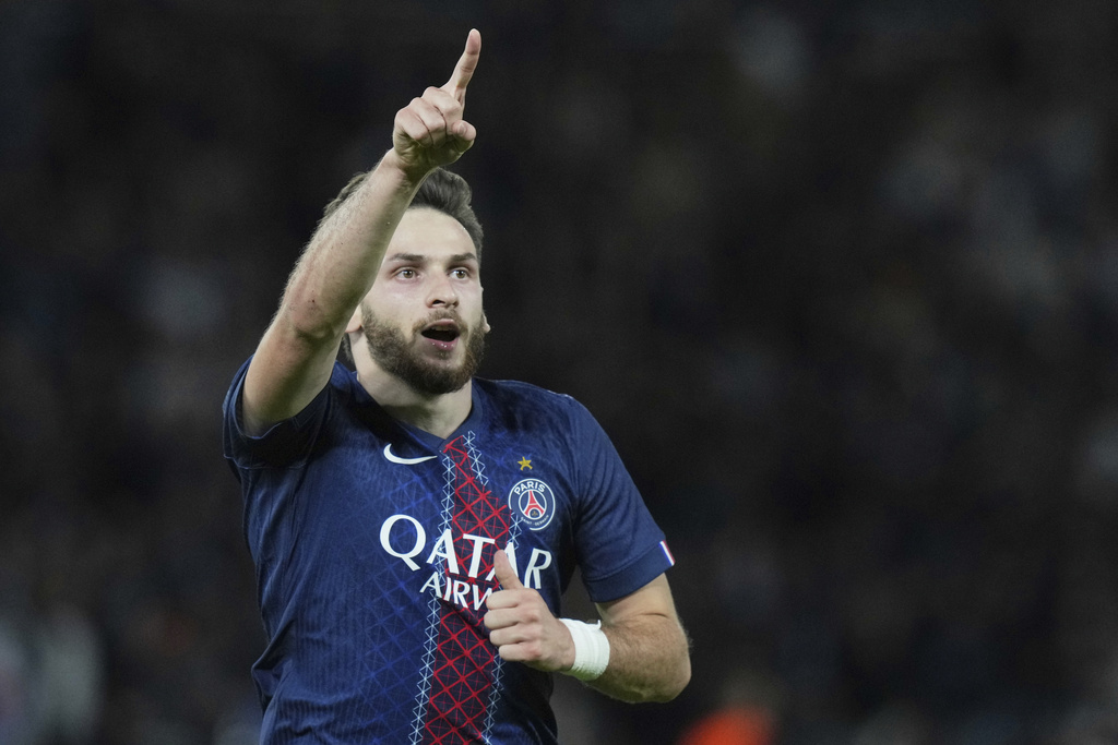 PSG's Khvicha Kvaratskhelia celebrates after scoring his side's second goal during the Champions League opening phase soccer match between Paris Saint-Germain and Atalanta at the Parc des Princes stadium in Paris, France, Wednesday, Sept. 17, 2025. (AP Photo/Thibault Camus)